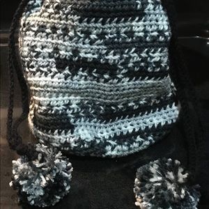 Crochet bag with pom-poms